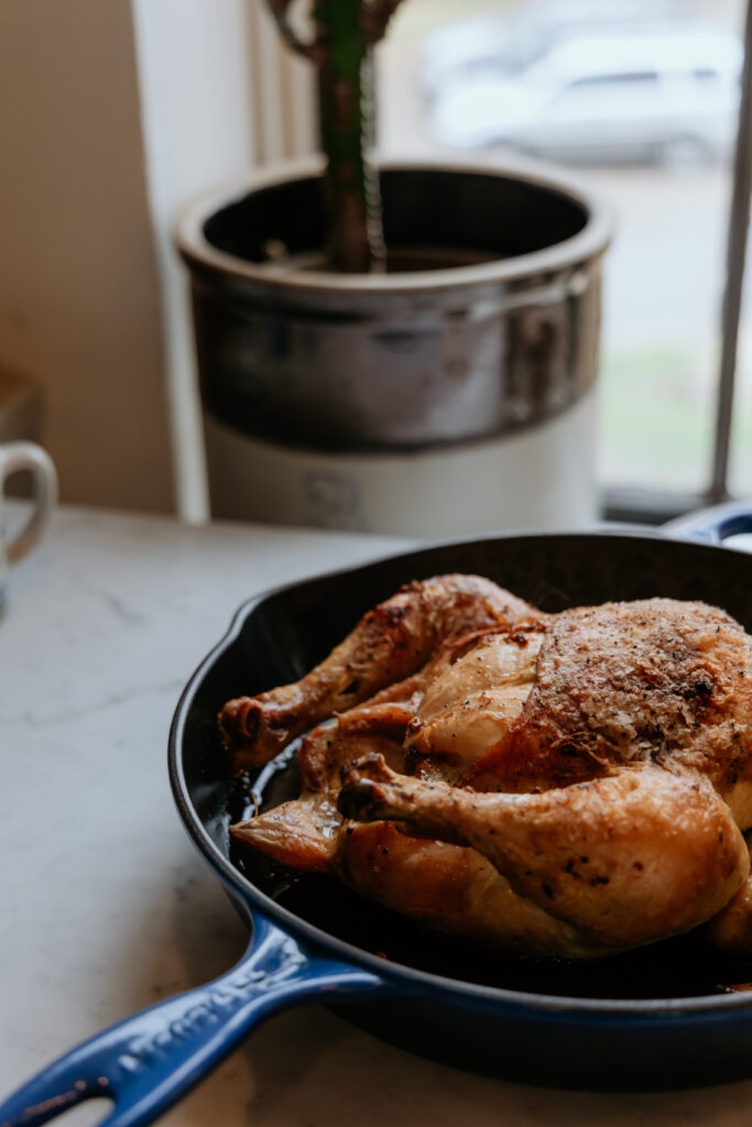 Roasted chicken resting on the counter top.