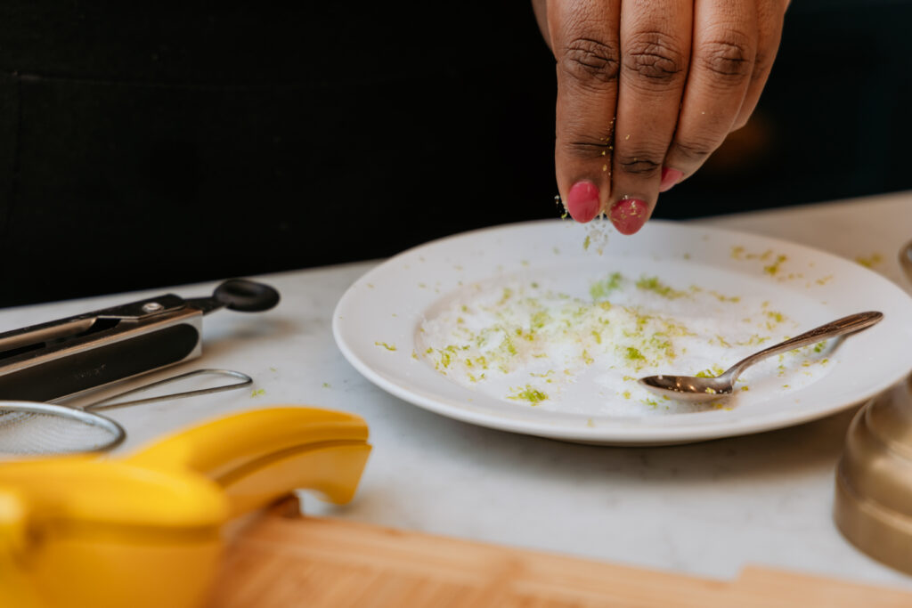 Kandice is mixing lime zest into salt.