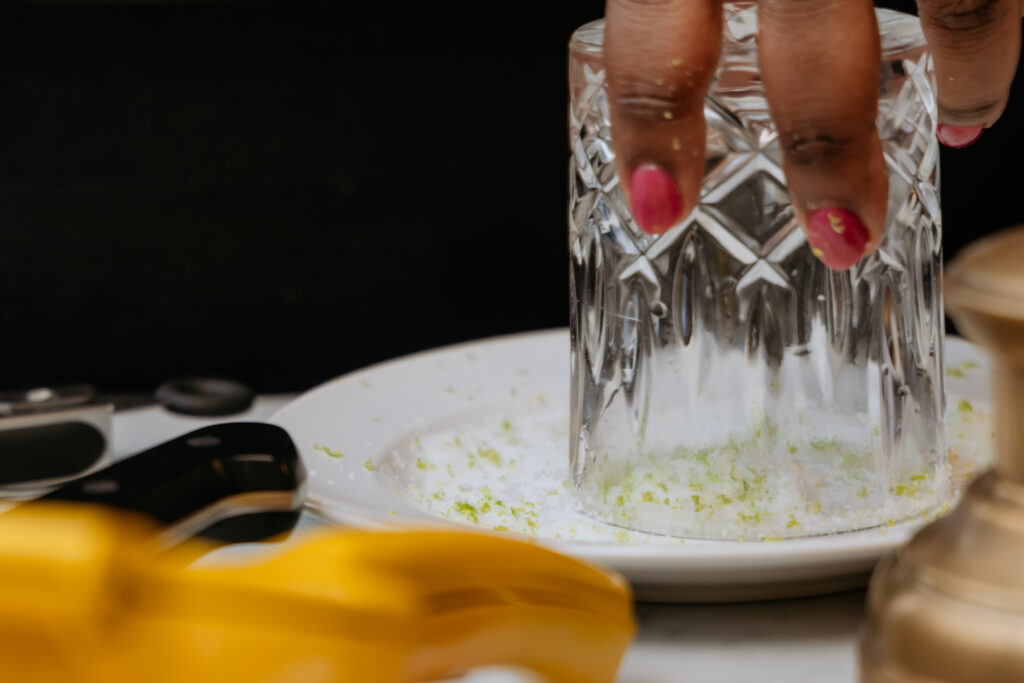 Kandice is rimming the glass for a classic lime margarita.