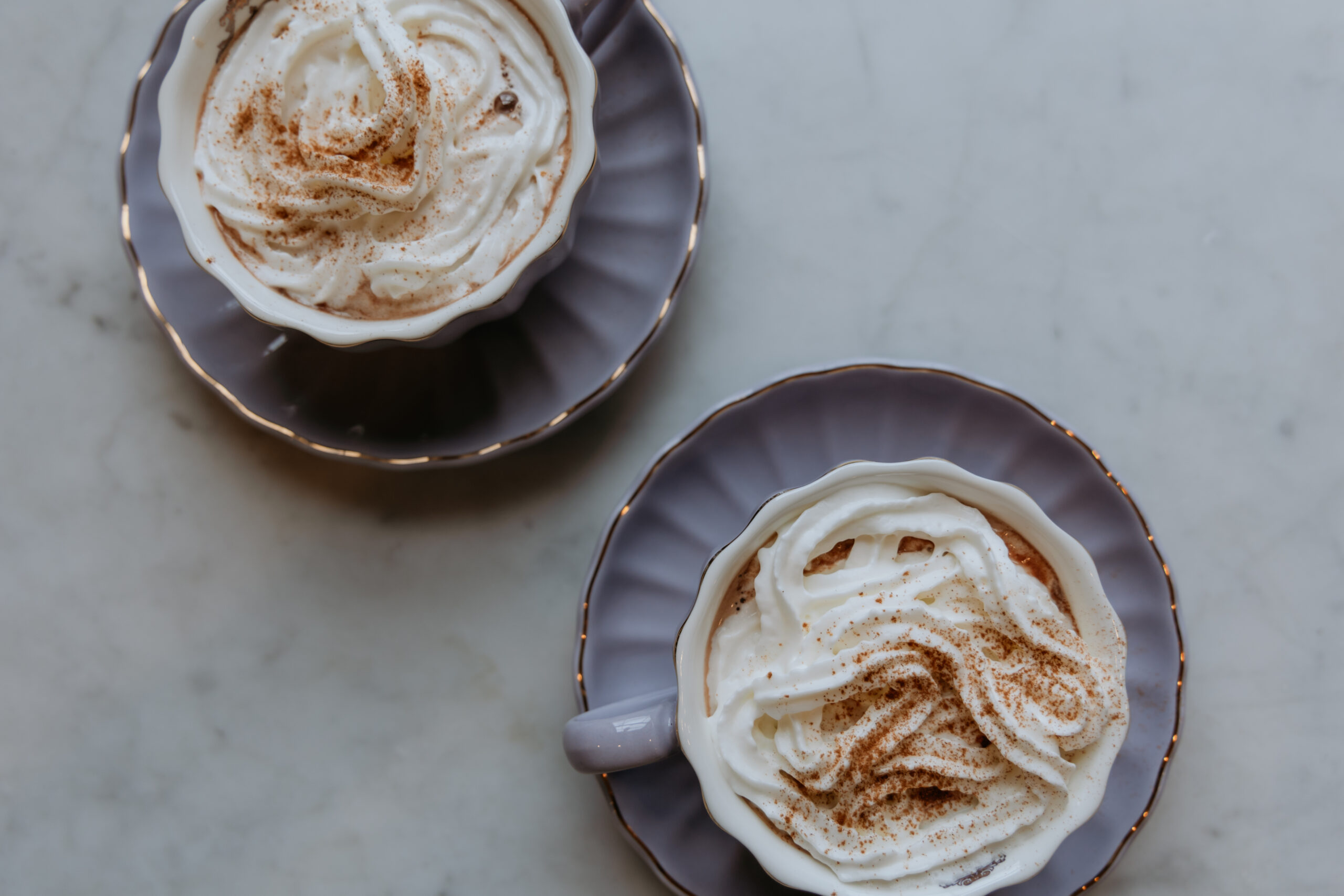 Overhead photo of hot chocolate in a saucer.