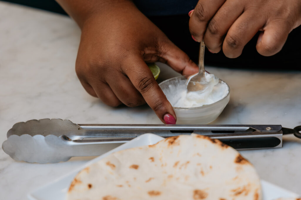 Mixing together crema in a small bowl.