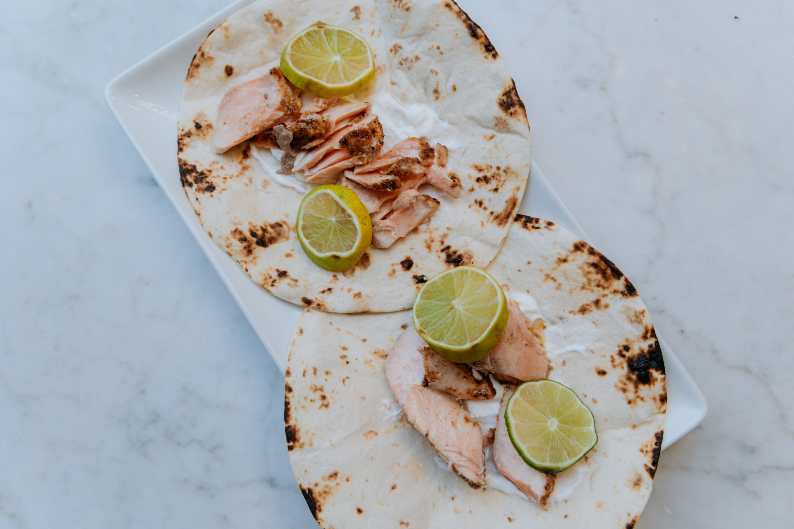 Easy salmon tacos on a plate.