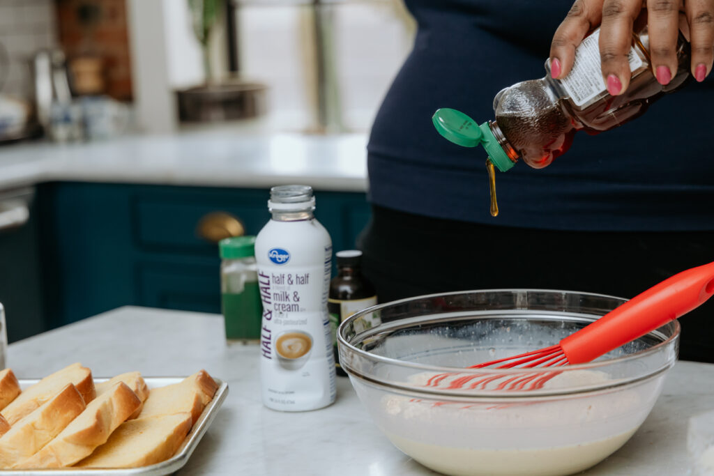 Adding honey to custard mixture,