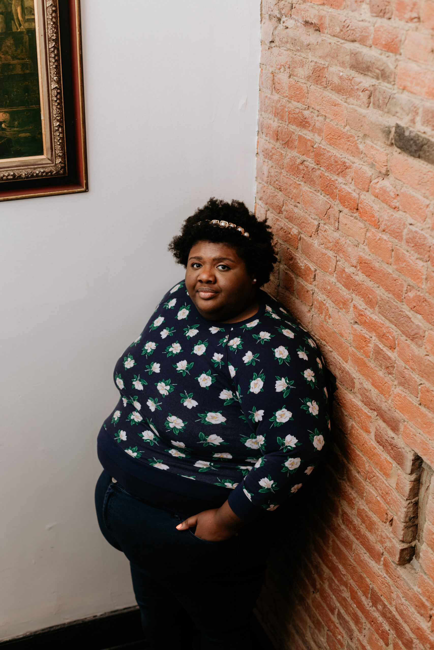 Kandice is standing in a stairwell.