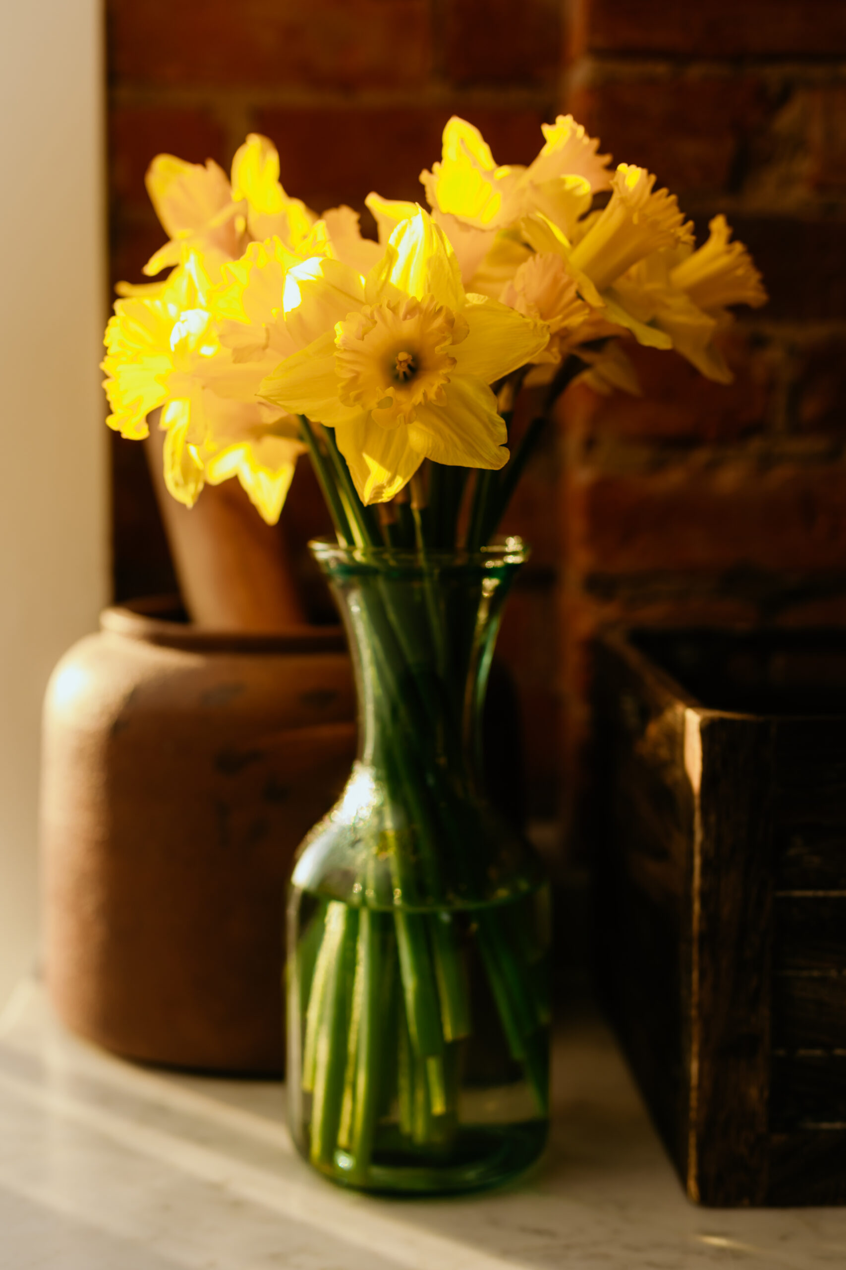 Vase of yellow flowers