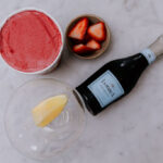 A flat lay of raspberry sorbet Prosecco float