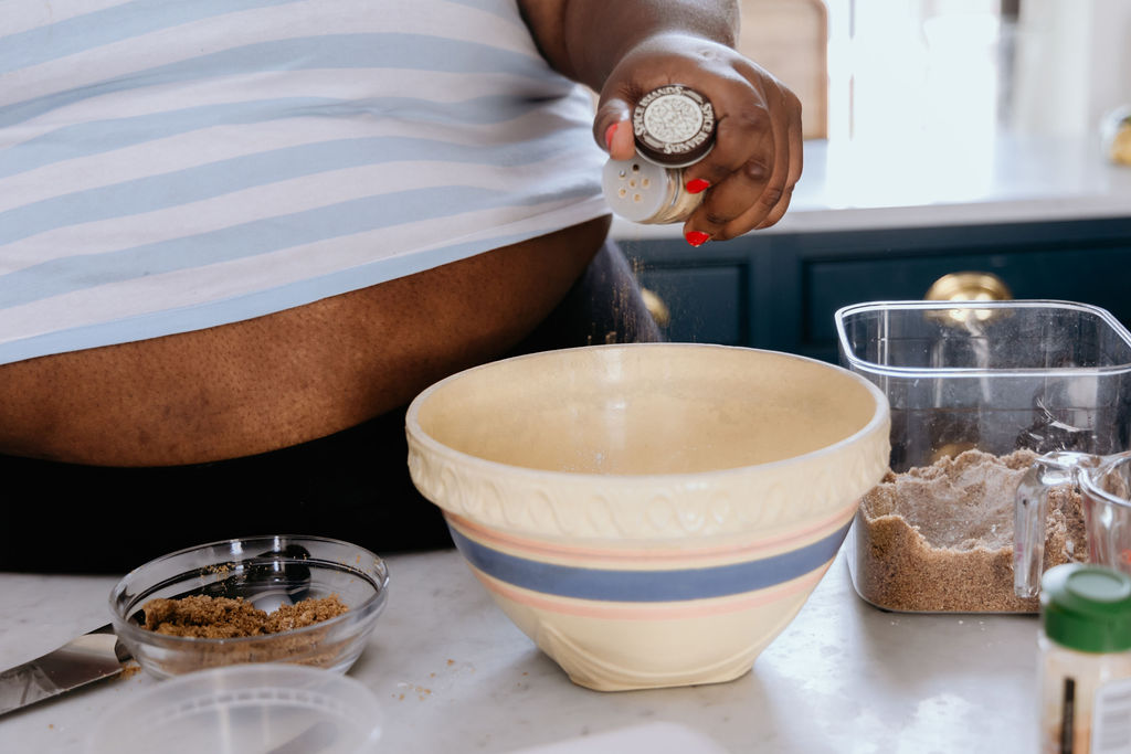 Kandice is adding cardamom to crisp mixture.