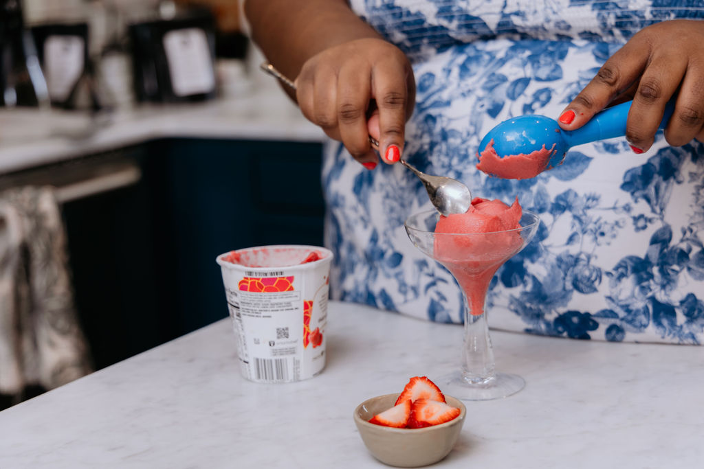 Kandice is scooping sorbet for a raspberry sorbet Prosecco float.