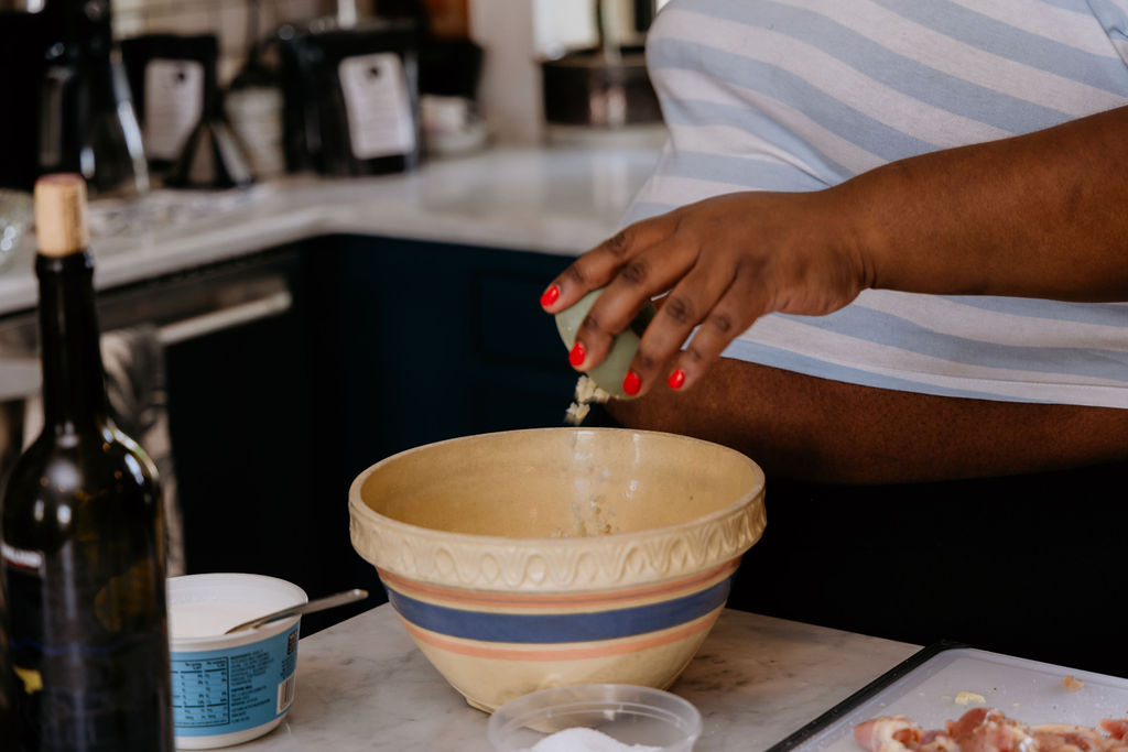 Adding garlic to bowl.