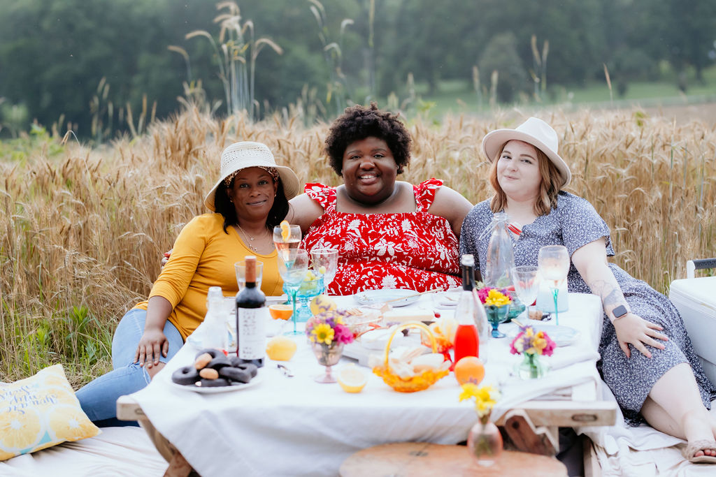 Kandice. Shanika, and Jaden enjoying a picnic.