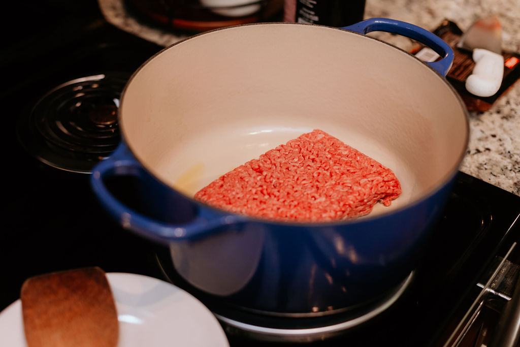 Ground chuck browning in a pot.