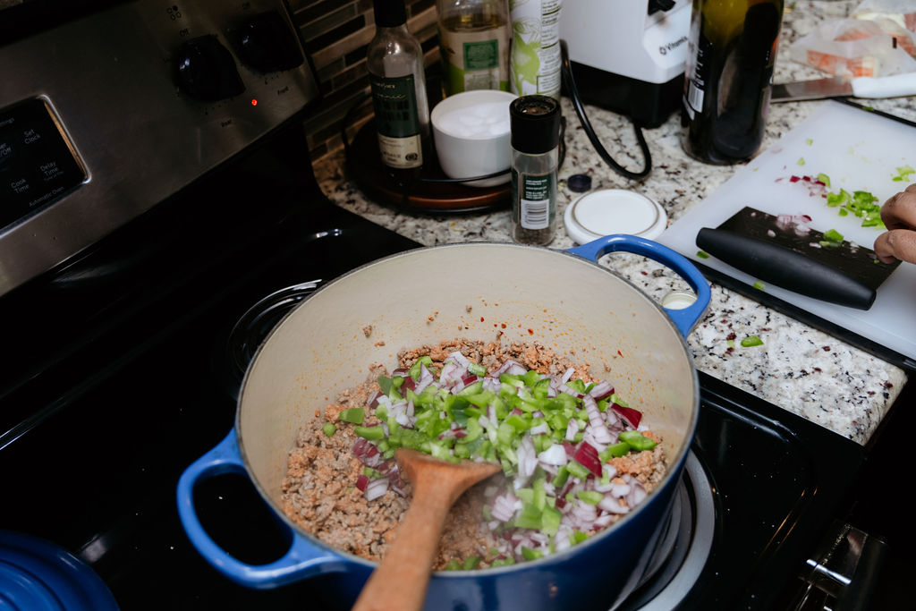 Close up of chopped veggies in pot.